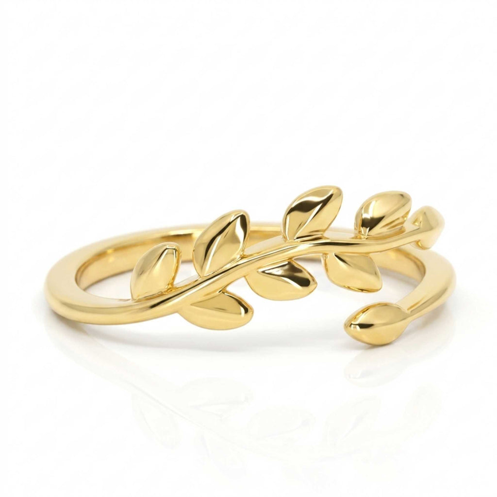 Gold leaf-shaped adjustable ring for women by Satinski on a white background