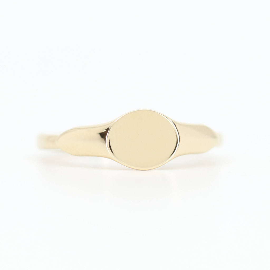 Front view of Allring adjustable gold dainty signet ring, smooth polished finish, resizable band