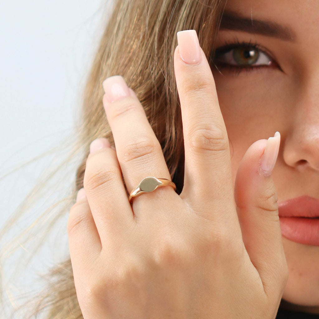 Allring adjustable gold dainty signet ring worn on middle finger, stackable and stylish