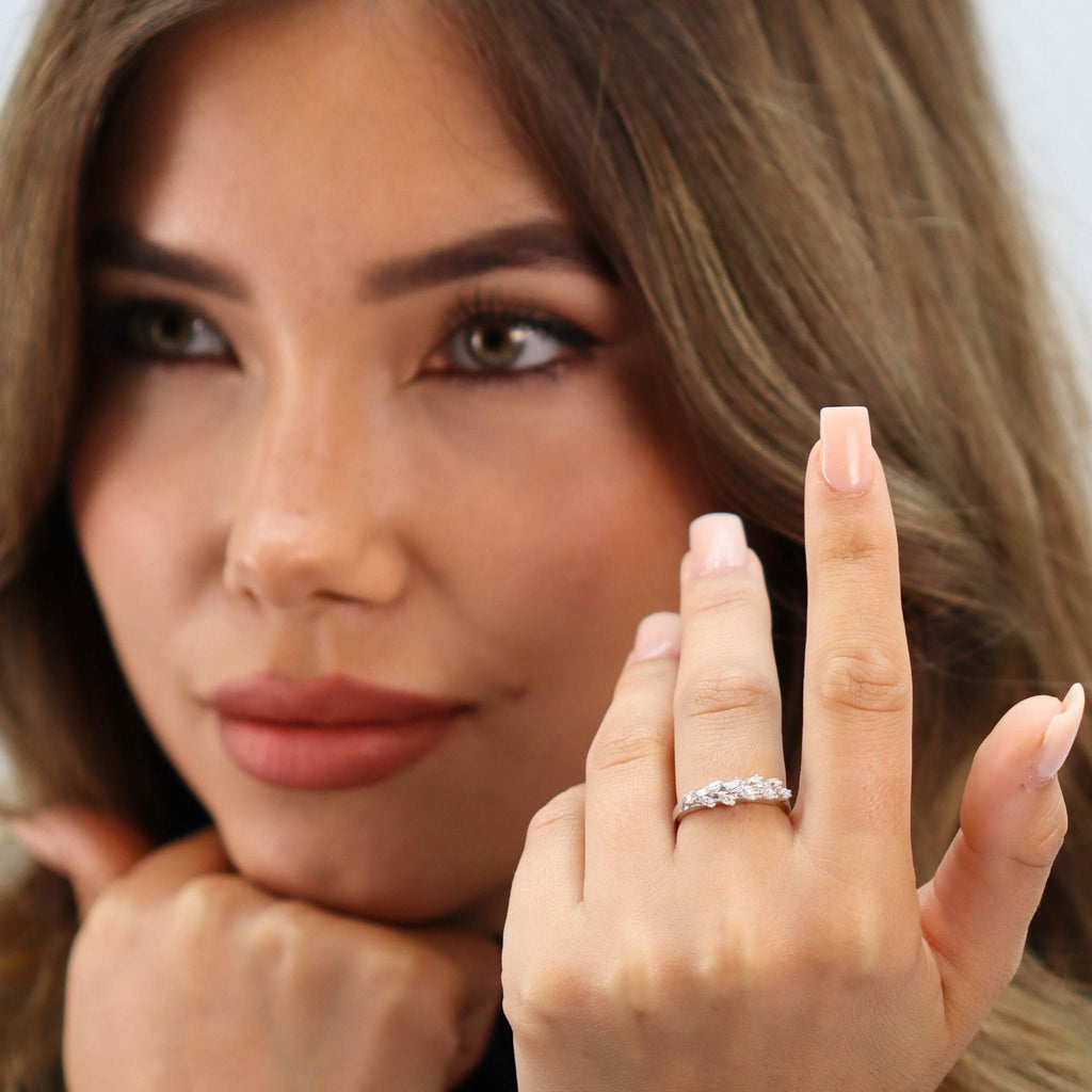 Allring adjustable white gold olive leaf ring worn on finger, showcasing resizable fit for women with arthritis or swelling