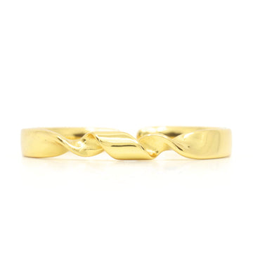 Gold ring with a twisted design on a white background