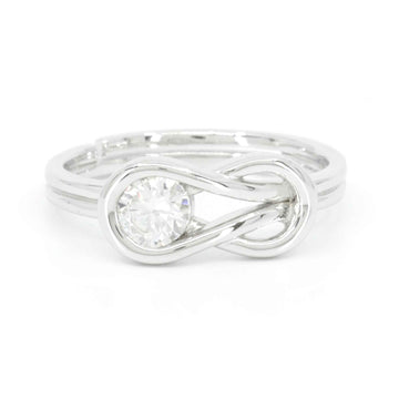 Front view of white gold infinity engagement ring with moissanite and elegant open design
