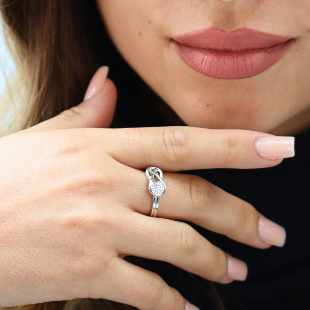 Close-up of the hidden adjustable band on white gold infinity ring for arthritic or swollen fingers