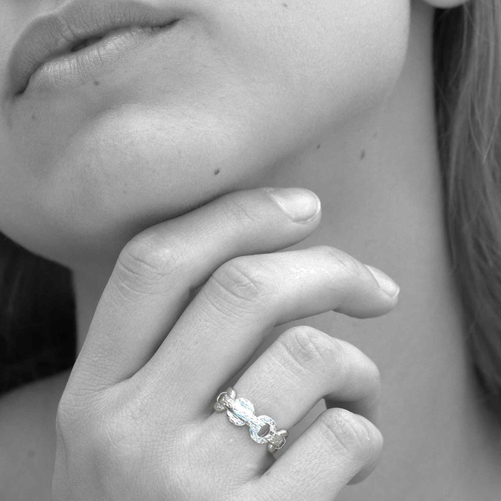 Satinski cross chain solid open silver resizable stacking ring